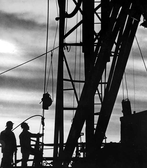 Workers on an oil rig, Smiley, Saskatchewan