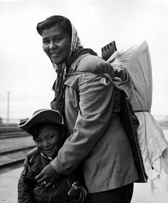 Cree woman with her son and baby on cradleboard