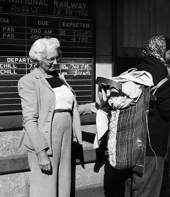 Cree baby in cradle board receiving attention at the Churchill Rail Station
