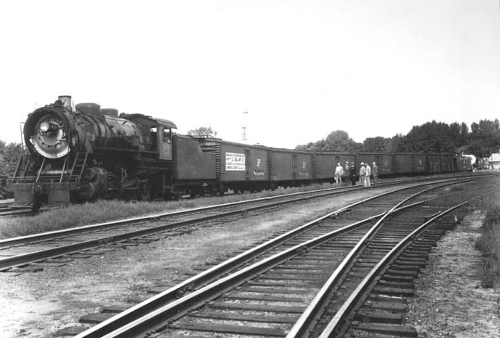 Central Vermont Railway maple syrup train leaving Burlington, Vermont headed by steam locomotive 451