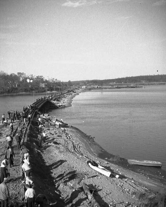 Hurricane damage affecting the Central Vermont Railway docks at New London, Connecticut - causeway and bridge