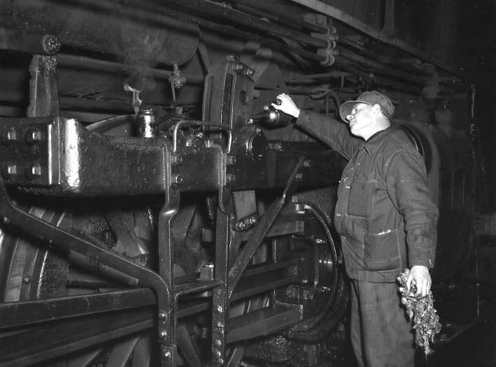 Oiling a steam locomotive on the Central Vermont Railway.