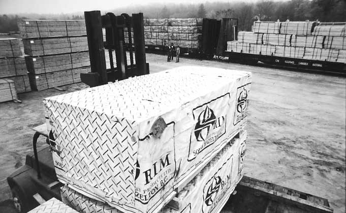 Lumber distribution yard on the Central Vermont Railway, showing lumber from British Columbia..