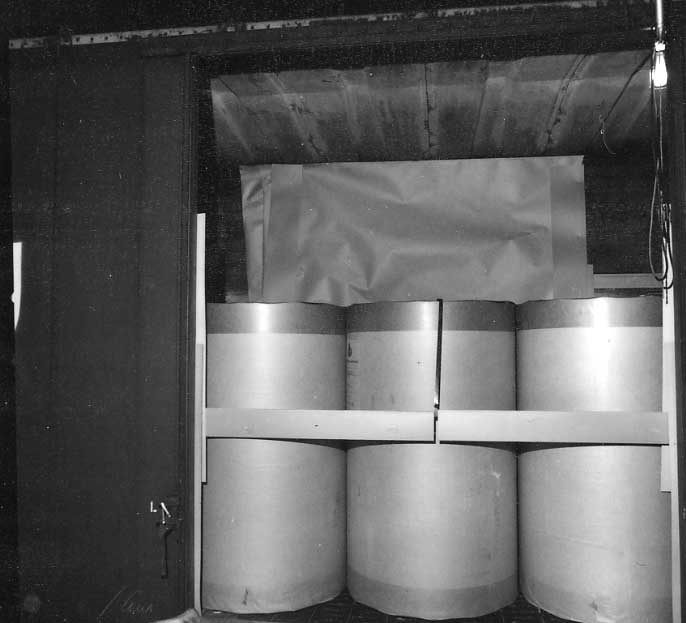 Newsprint rolls loaded into a boxcar.