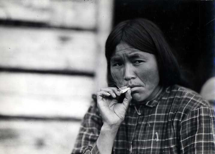 Stuart Lake woman in plaid blouse, smoking
