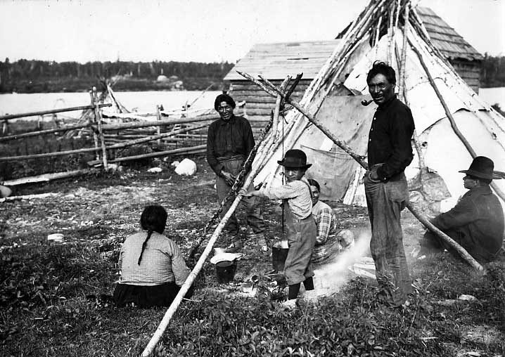 Ojibwa families making tea at campfire