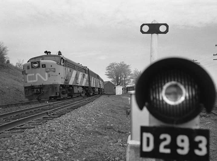 The Ocean limited and a dwarf signal.  Diesel locomotive FPA-4 6764.