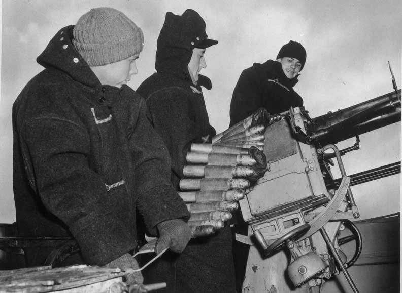 Canadian destroyer crew practices with anti-submarine guns