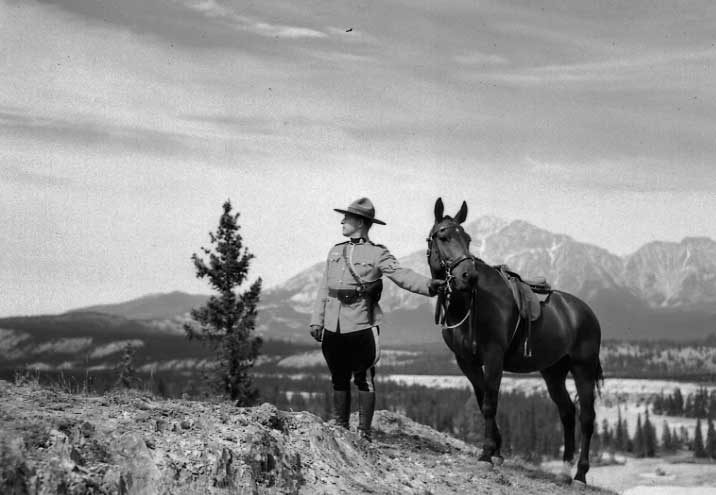 RCMP officer with his horse, Jasper, Alberta