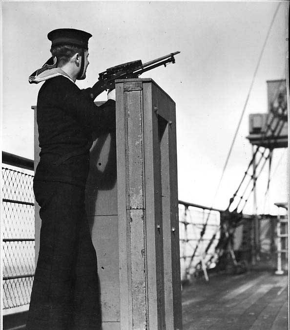 Naval machine gunner stationed behind special protected post on upper deck of the SS Prince Rupert