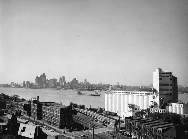 A view of the Hiram Walker Distillerywith the Detroit skyline in the background
