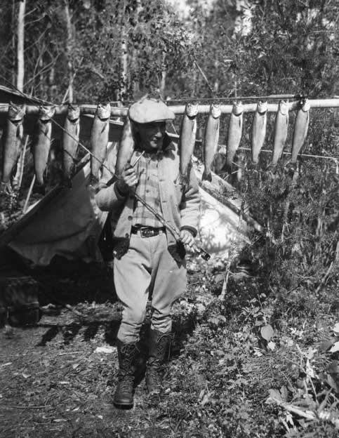 Fisherman with his catch of trout
