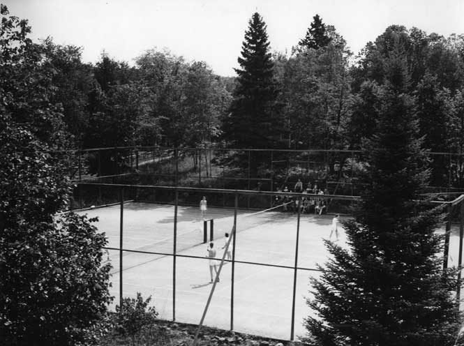 Playing tennis at Round Lake House