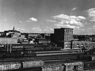 A view of the railroad tracks of the Saskatoon CN station, with the Bessborough Hotel in the distance