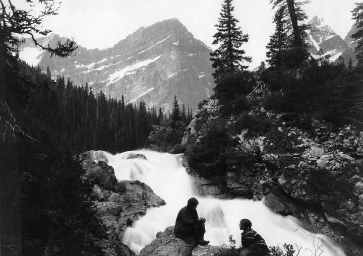 Hikers resting by Chrome Lake Falls
