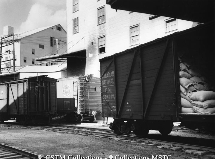 Freight cars at loading platforms of mine, Asbestos, Que