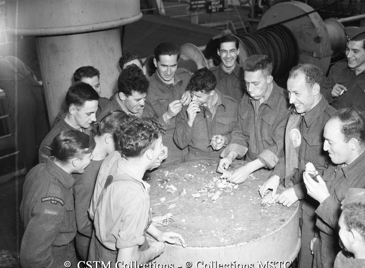 Troops enjoying a lobster feast onboard the Lady Rodney