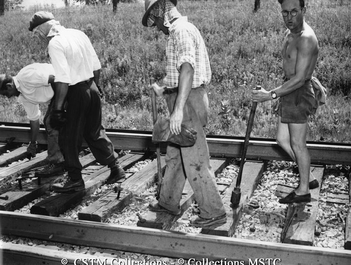 Putting wooden plugs in spike holes, near Brantford, Ontario