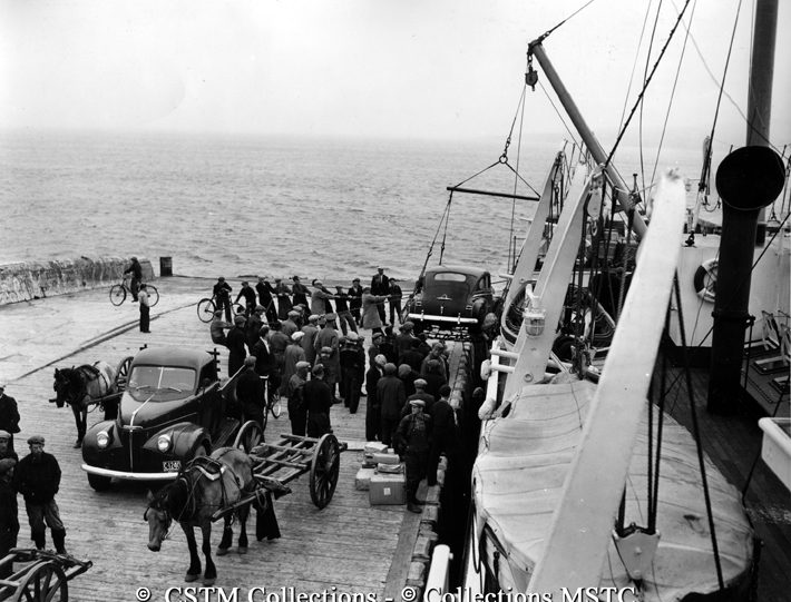 An automobile is landed from the S.S. Bar Haven, Grand Bank