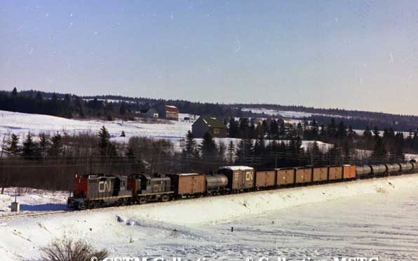 Moncton-Sackville freight train in New Brunswick.  Locomotives are GP-9 4476 and RS-3 3040