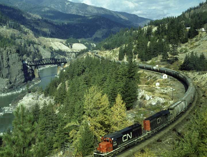 Two SD-40 diesel locomotives with a westbound unit train of potash