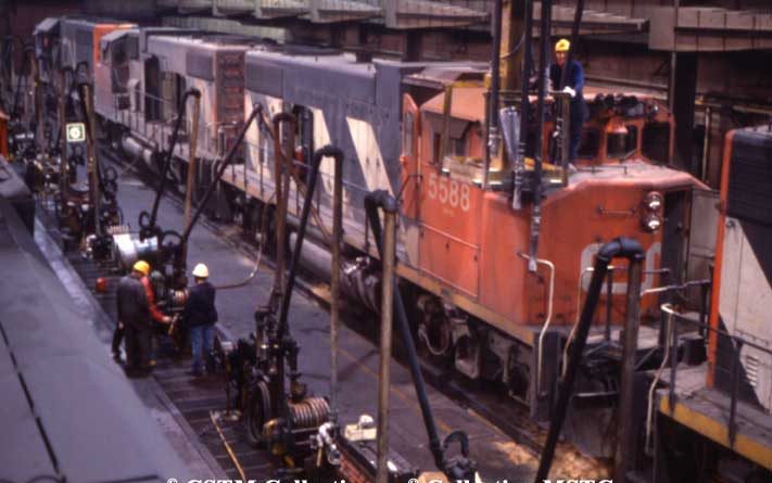 Indoor fuel and sanding facility at Tascherean Yard with GP38-2 locomotive 5588