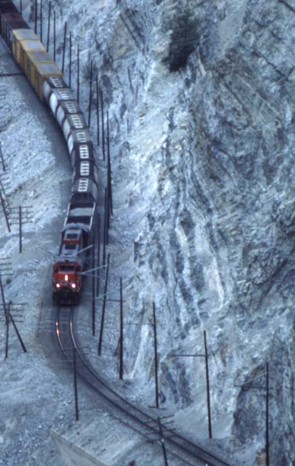 Freight train east of Lytton, B.C. with slide fence and ditch lights