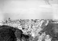 Tourists on a H.B. Railway excursion examining the ruins inside Fort Prince of Wales