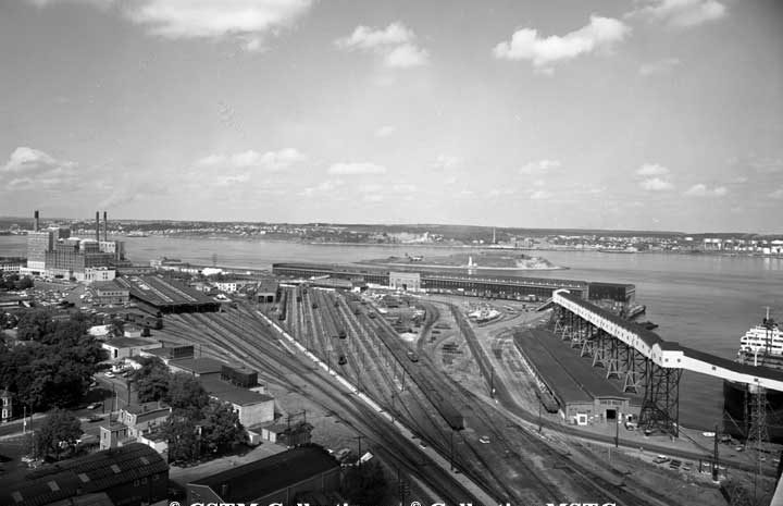 View of Halifax harbour from grain elevators, showing railway yards and Pier 21