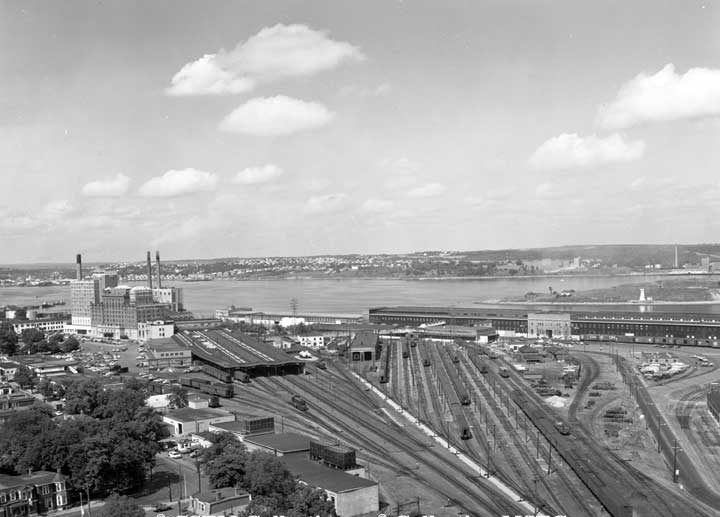 View of Halifax harbour from grain elevators, showing the Nova Scotian Hotel, station, railway yards and Pier 21