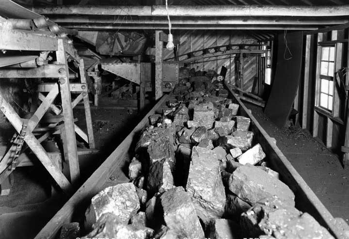 Picking table below rotary dump, showing quality of size of mine vein - Murray Mine