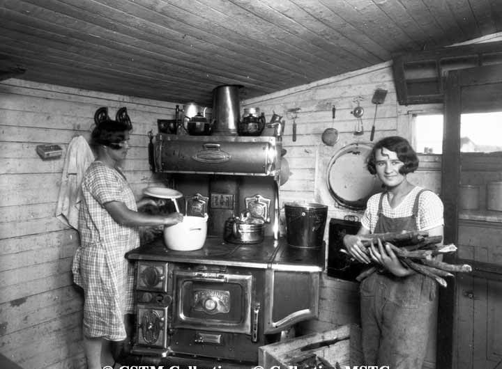 St. Jean Baptiste, Manitoba - preparing dinner in first house