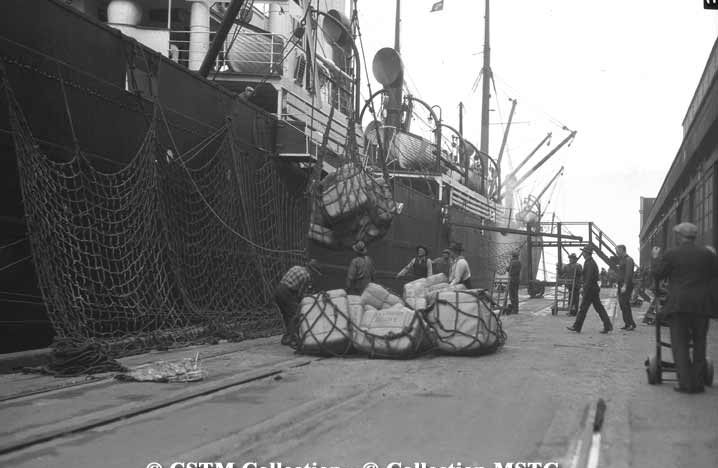 Canadian National - silk from Orient being unloaded from the hold of a Pacific liner at Vancouver