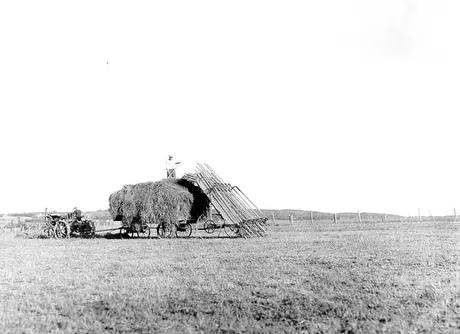 Loading hay mechanically