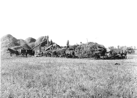 Stack threshing with Aultmann-Taylor threshing machine and portable gas engine