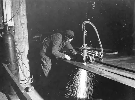Prince Rupert shipyard : torches are used for cutting steel plates