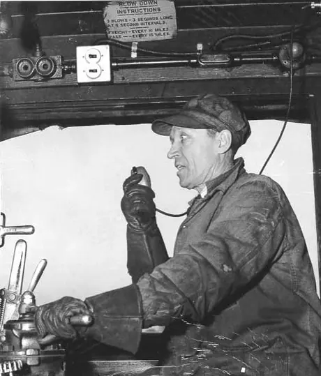 Engineer (Finnemore) of steam locomotive communicating by radio