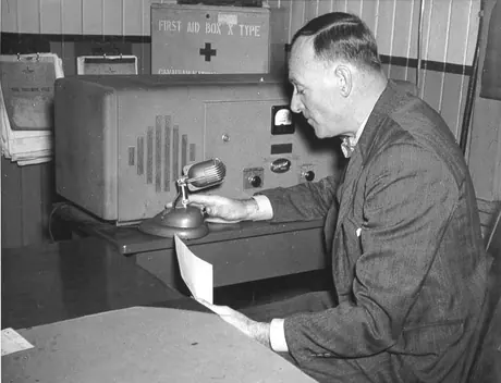 A CNR executive tests radio communication with a locomotive