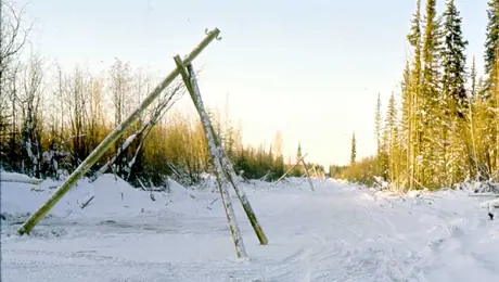 Tripods replace poles to carry wires over permafrost