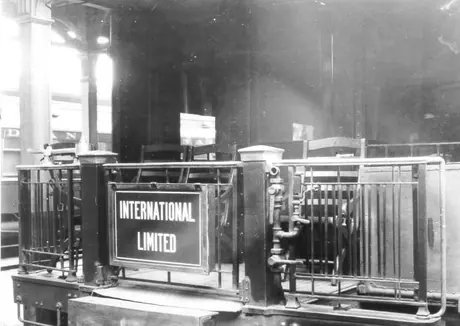 Train International Limited drumhead on the rear platform of an open observation car