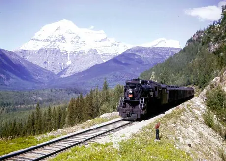 A steam passenger train in the Rockies