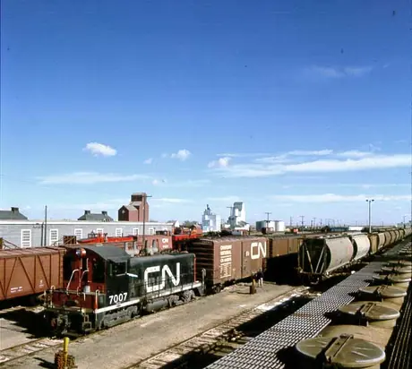 Freight train transporting potash in yard