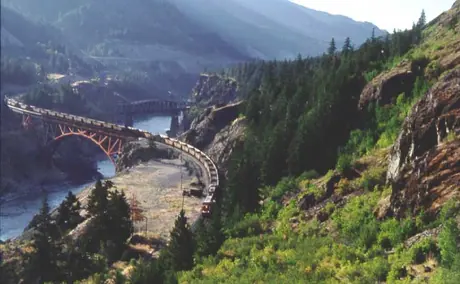 Freight train crossing the Cisco Bridge on the Fraser River