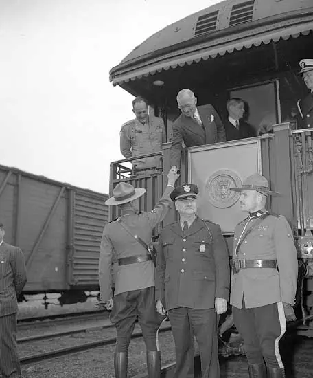 U.S. President Truman shaking a mountie's hand