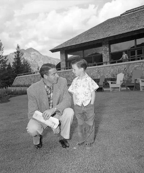Baseball player Joe DiMaggio and young friend