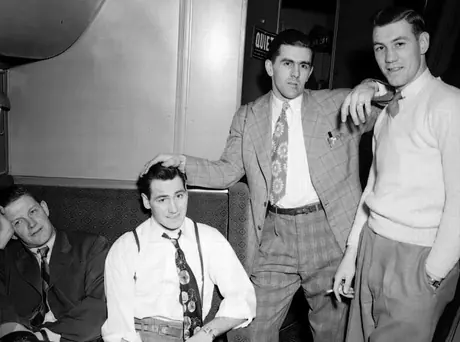 Canadien hockey team (from left to right: Murph Chamberlain, Jimmy Peters, Maurice Richard, and Kenny Mosdell) enroute to Boston for the play-offs