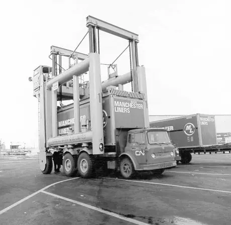 Containers loaded onto trucks