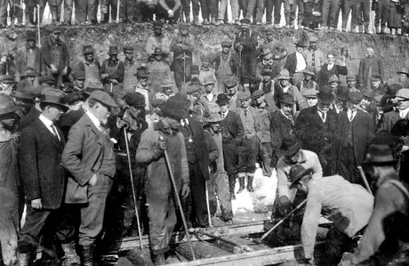 Workers lay the last rail of the Grand Trunk Pacific Railway line at mile 1372.7
