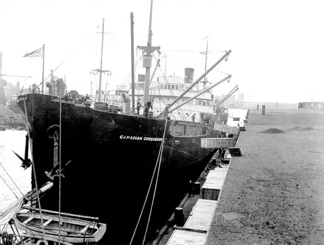 Cargo ship CGMM Canadian Conqueror loading cars in crates
