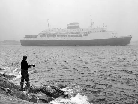 Ferry MV William Carson with fisherman in foreground